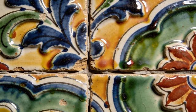 Hand-painted glazed ceramic tile pattern with crackle glaze and rustic chipped edges
