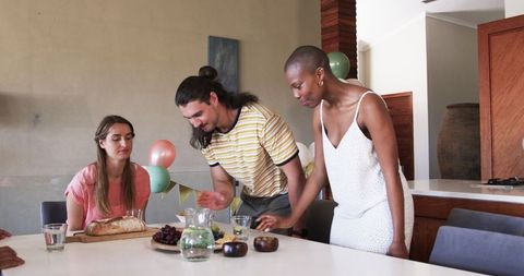 Friends Toasting and Enjoying Home Celebration Party