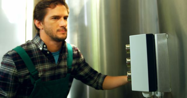 Male Technician Working with Industrial Control Panel in a Factory Setting - Download Free Stock Images Pikwizard.com