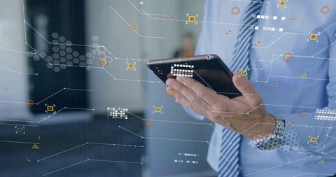 Businessman holding tablet tapping touchscreen with digital hud overlay for data control