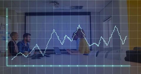 Professional team analyzing data graphs in modern boardroom