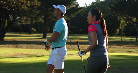 Duo Celebrating in Sunny Golf Course with High Five - Download Free Stock Images Pikwizard.com