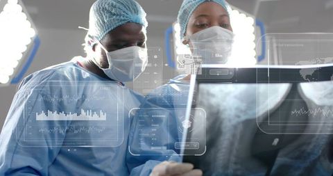 Surgeons Analyzing X-Ray Data with Holographic Interface