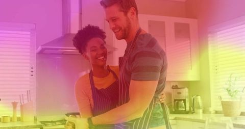 Romantic Couple Cooking Together at Home in Warm Hardy Kitchen