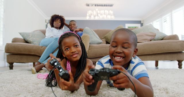 Happy African American Family Bonding and Playing Video Games at Home - Download Free Stock Images Pikwizard.com