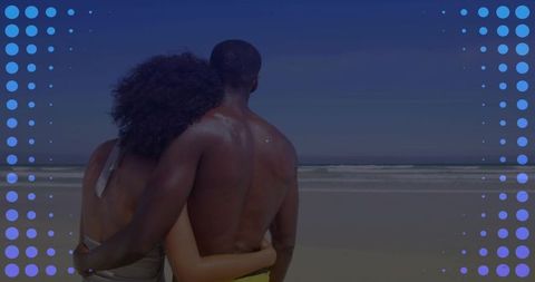 Couple hugging on sunny beach facing ocean with dotted blue overlay for summer romance
