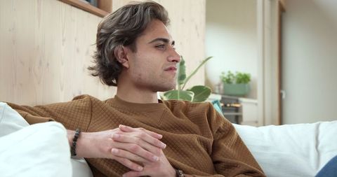 Relaxed Man in Cozy Living Room with Natural Light