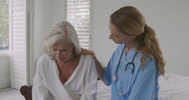 Nurse Comforting Elderly Woman at Home - Download Free Stock Images Pikwizard.com