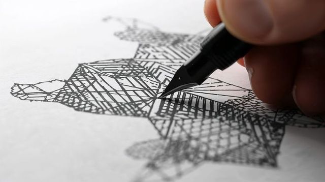 Hand drawing geometric ink sketch with fountain pen nib closeup high-contrast linework