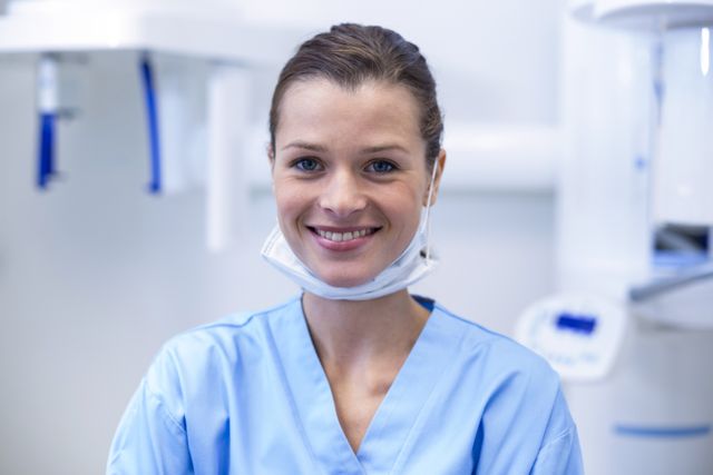 Portrait of smiling dental assistant in dental clinic