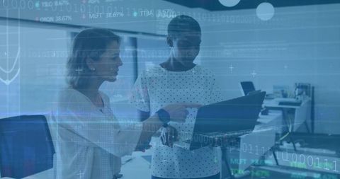 Professional Women Analyzing Data for Innovative Solutions