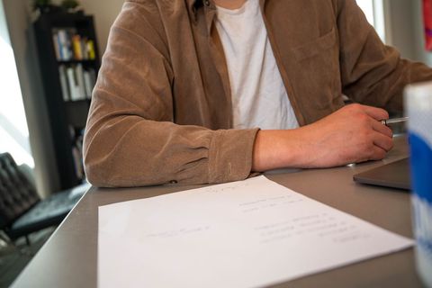 Man in casual shirt working at desk