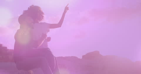 Couple Embracing in Dreamlike Setting Overlooking View