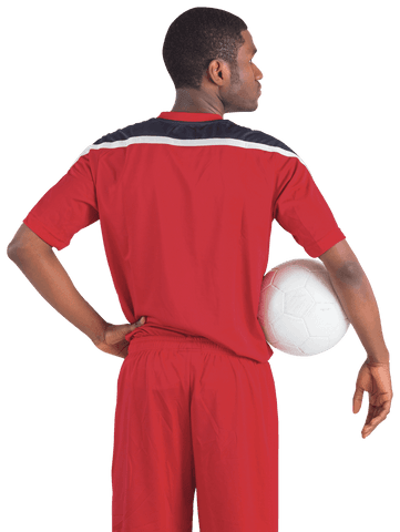 Confident football player in red uniform holding soccer ball transparent background