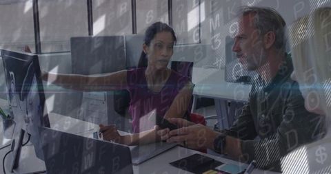 Collaborating over monitor and smartphone with digital data overlay in bright contemporary office