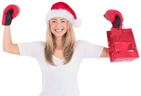 Festive woman with boxing gloves and santa hat celebrating