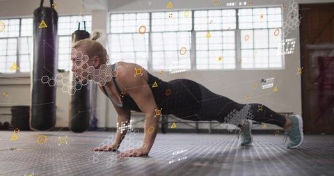 Female Athlete With Virtual Tech Overlays Doing Plank in Gym