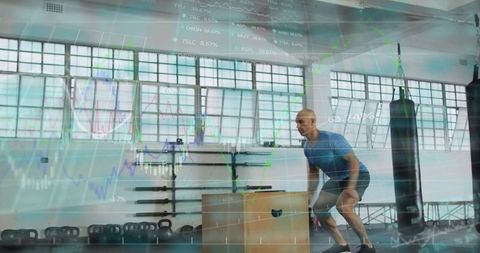 Athlete preparing plyo box jump with digital performance data overlay, industrial gym
