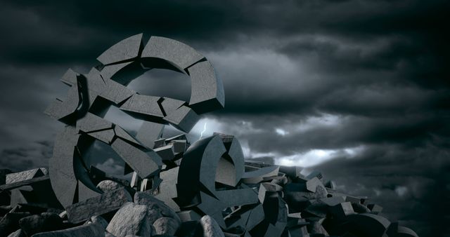 A pile of broken stone pieces forms a chaotic and abstract landscape under a stormy sky. The image evokes a sense of destruction or the remnants of a once-whole structure, now shattered.