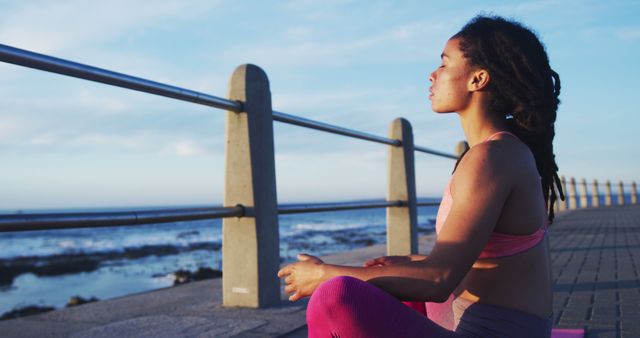 Woman Practicing Yoga by Ocean at Sunrise - Download Free Stock Images Pikwizard.com