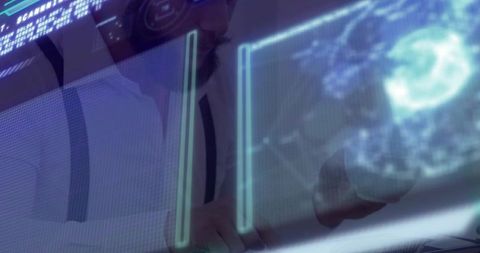 Operator manipulating holographic globe at futuristic workstation with blue digital interface