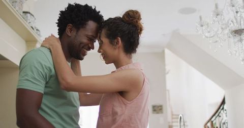 Happy Couple Embracing in Cozy Home Kitchen Setting