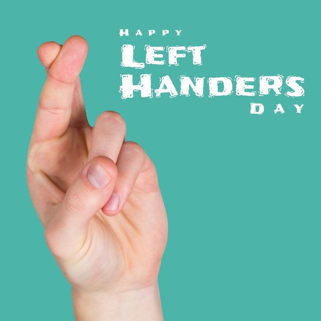 Cropped hand of caucasian person crossing fingers and happy left handers day text on blue background. Copy space, composite, unique, lefty, problems, celebration and awareness concept.