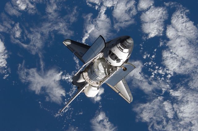 Discovery and Payload on approach to the ISS during the STS-120 Mission - Download Free Stock Photos Pikwizard.com