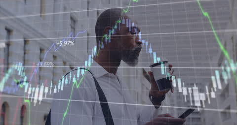 Businessman Analyzing Financial Graphs While Using Smartphone on Urban Street