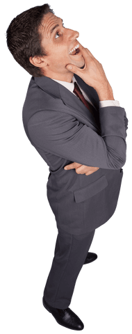 Thinking Businessman in Suit Touching Chin with Curiosity