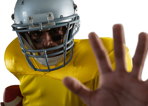 Focused football player in yellow jersey making gesture transparent background