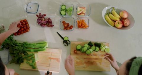 Diverse Friends Engaged in Healthy Home Cooking Together