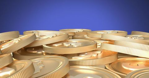 golden coins piled against blue background - Download Free Stock Images Pikwizard.com
