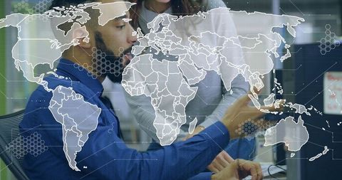 Professional team analyzing global data on computer screen