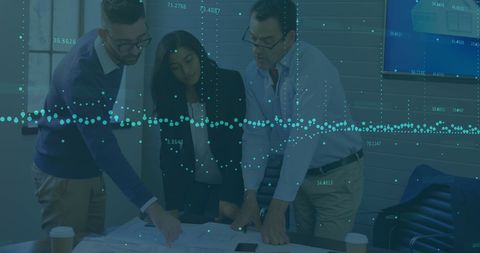 Team analyzing business analytics data in modern office