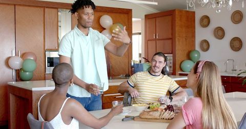 Diverse Friends Socializing in Modern Kitchen Setting