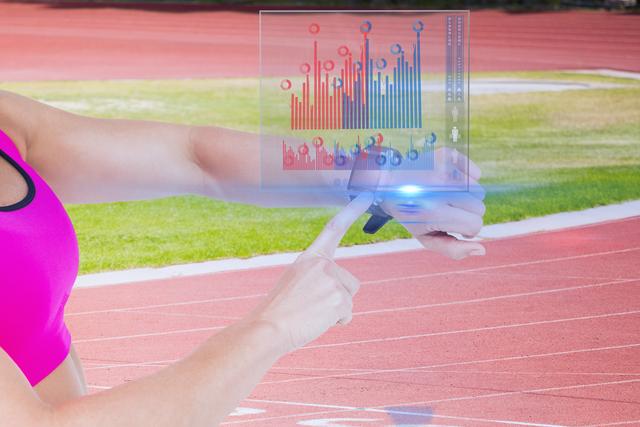 Athlete Using Smartwatch with Interactive Fitness Statistics on Track - Download Free Stock Photos Pikwizard.com