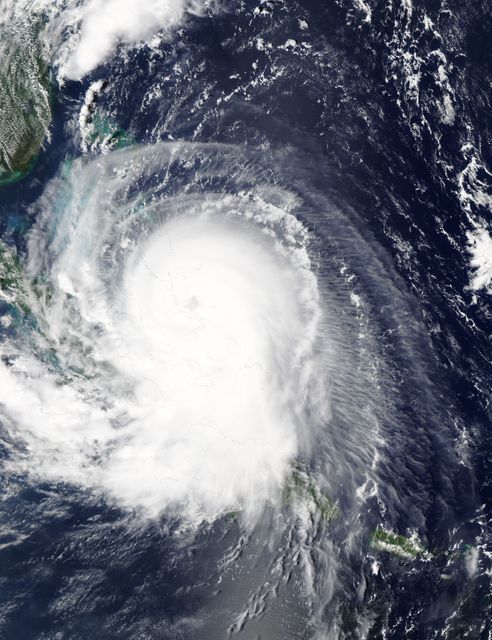 Satellite image capturing Hurricane Joaquin's powerful structure over the Bahamas, highlighting the storm's intensity and movement. Ideal for weather analysis, educational content on hurricanes, natural disaster documentaries, and climate change discussions.
