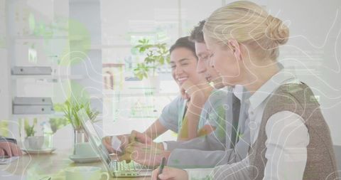 Diverse Business Team Analyzing Data with Technology Augmentation