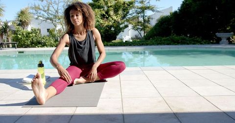 Woman Practicing Yoga by Sunny Pool Cozy Garden Vibes