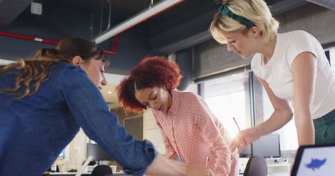 Diverse Female Professionals Collaborating in Open-Plan Office