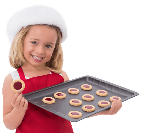 smiling girl in santa hat holding tray of festive cookies transparent background - Download Free Stock Videos Pikwizard.com