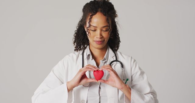 This image can be used to promote healthcare services, cardiology centers, heart health awareness campaigns, or compassionate patient care. Perfect for medical websites, blogs, or brochures showcasing the dedication and empathy of healthcare professionals.