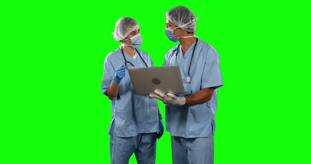 Two Medical Professionals Discussing Patient Data on Green Screen Background - Download Free Stock Images Pikwizard.com