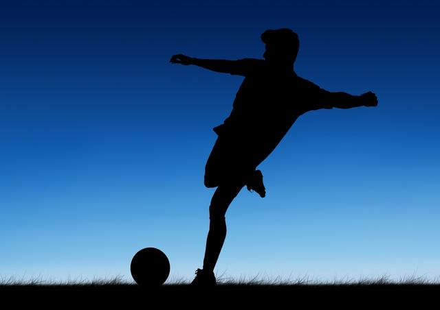 Silhouette of a soccer player kicking a ball against a blue sky at sunset. Ideal for sports-related content, motivational posters, athletic advertisements, and dynamic action scenes.