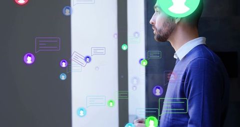 Business Professional Gazing Out Window with Digital Icons