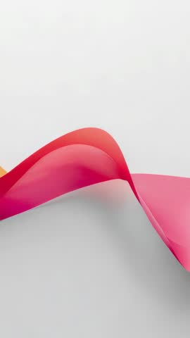 Vertical looping pink-coral ribbon twisting in glossy gradient motion for backgrounds