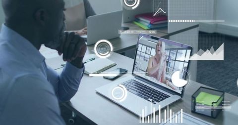 Executive watching laptop during virtual meeting with analytics dashboard overlay