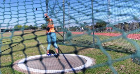 Female Athlete Training Discus Throw at Outdoor Track - Download Free Stock Images Pikwizard.com