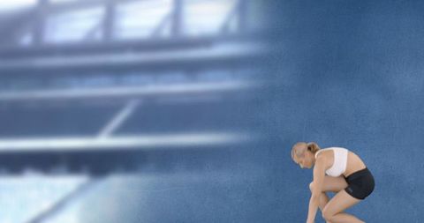 Athletic Woman Preparing for Race in Stadium Environment